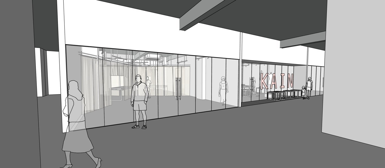 Architectural render of the B1 incubator frontage: a glass shopfront along the corridor, with the KAIN sign further along