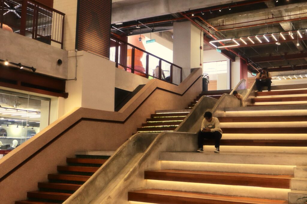 The lit staircase inside Semua House